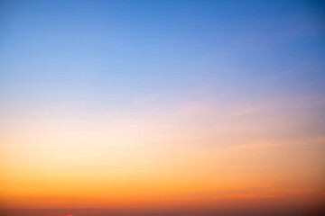 Sky,sunset, beautiful , luxury soft gradient orange gold clouds and sunlight on the blue sky perfect for the background, Sunrise on morning or everning in winter warm time ,Twilight summer,silhouette