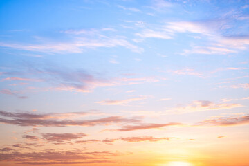 Fototapeta premium Sky,sunset, beautiful , luxury soft gradient orange gold clouds and sunlight on the blue sky perfect for the background, Sunrise on morning or everning in winter warm time ,Twilight summer,silhouette