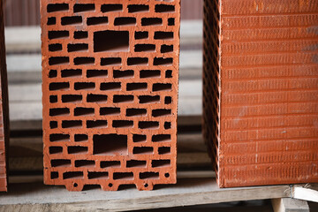Naklejka premium Close-up of red clay bricks showing detailed texture and form