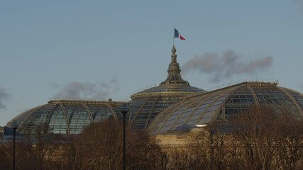 Grand Palais in Paris with French flag