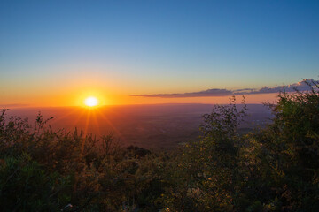 Sunset at the iconic Merlo sign in the picturesque town of Villa de Merlo, San Luis, Argentina. Photograph taken in 2024, highlighting an emblematic tourist landscape.