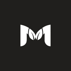 M letter logo design with two leaves a creative and nature inspired logo, M beautifully combined with two leaves agricultural ventures branding.