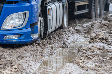 truck buried in mud - truck - logistical problems