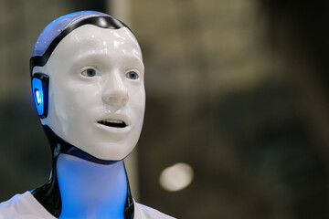 Close-up of futuristic humanoid robot with glowing blue features, showcasing advanced technology.
