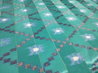 Fototapeta premium Flora, batik, micro dot cloth texture, gold, yellow, grey, blue, green, brown color natural background color clothing, south east Asia, traditional pattern