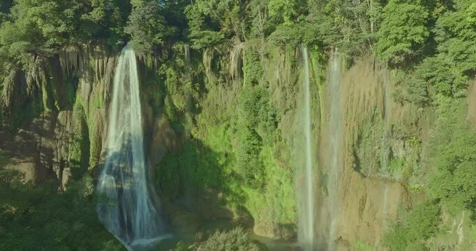 aerial view above the top of Thi Lor Su waterfall. Numerous waterfalls flow from wide, steep cliffs. waterfall Nestled amidst the untouched beauty of Tak Province. The Largest Waterfall in Thailand