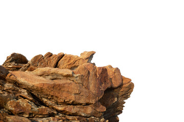 A rock cliff isolated against a white background, showcasing jagged edges and rugged textures. Clipping path.