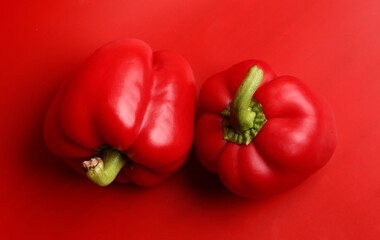 et of peppers on red background