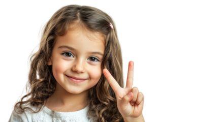 A cheerful young girl with curly hair shows a peace sign with her hand, conveying a sense of happiness and positivity against a white isolated background.