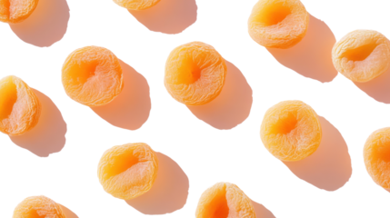 A top view showing fresh, vibrant apricot halves, arranged neatly with soft shadows on a white background, highlighting their rich orange color.