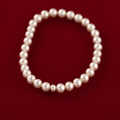 Obraz premium pearl necklace on red background
