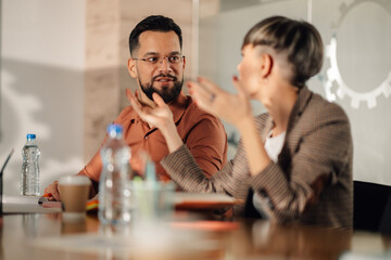 Business people talking during meeting in office boardroom