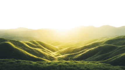 Stunning view of rolling hills under a bright sky, showcasing vibrant green grass illuminated by golden sunlight during sunrise or sunset.