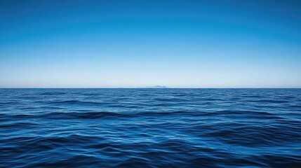 Fototapeta premium Serene Ocean View Distant Island Under Blue Sky