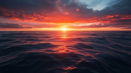 A Vibrant Sunset Over the Ocean with Red Clouds and Glowing Water