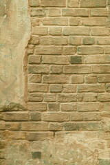 Brick beige background - the wall of a very old brick building