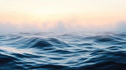 Fototapeta premium Serene Ocean Waves Under Misty Sunrise Sky