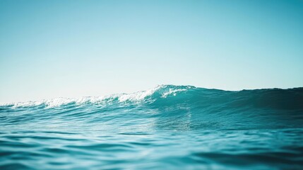 Fototapeta premium Ocean Wave Rolling Under Blue Sky