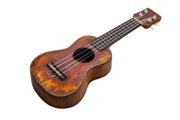 Vintage ukulele with worn wood finish resting on a white background in a cozy music setting