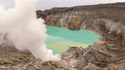 Aerial view of mount Kawah Ijen volcano crater. Is a group of composite volcanoes located on the border between Banyuwangi Regency and Bondowoso Regency of East Java, Indonesia