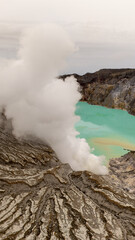 Aerial view of mount Kawah Ijen volcano crater. Is a group of composite volcanoes located on the border between Banyuwangi Regency and Bondowoso Regency of East Java, Indonesia