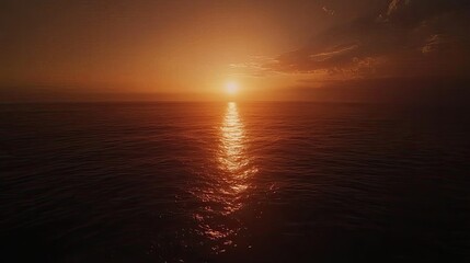 Obraz premium Golden Sunset Over Calm Ocean Waters
