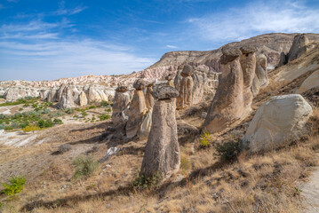Fairy chimneys, unique rock formations near Cavusin Town in Cappadocia, Turkey..