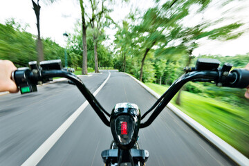Riding on high speed electric bicycle in park
