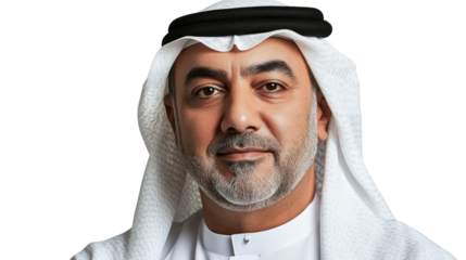 A confident Middle Eastern man in traditional attire, wearing a white kandora and headscarf, smiling against a plain backdrop.