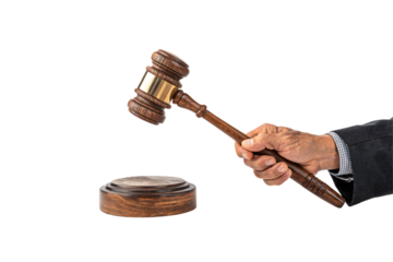 A wooden gavel with golden accents, held by a suited hand, epitomizing fairness, authority, and the weight of legal decisions. Isolated on a transparent background