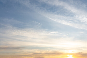 Fototapeta premium The vibrant hues of sunset paint the sky with a breathtaking display of orange, red, and yellow clouds