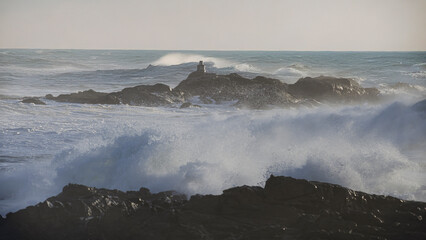 Breaking sea waves over rocks