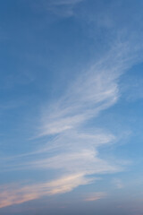 Beautiful white clouds drift across a vibrant blue summer sky, creating a stunning natural landscape