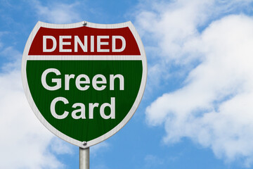 Green Card Denied Road Sign with blue sky