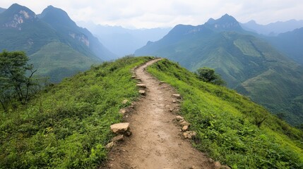 Fototapeta premium Muddy trails and scenic adventures. Scenic mountain trail surrounded by lush greenery.