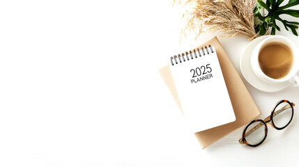 Organizing your time efficiently with a 2025 planner on a cozy desk home office planning essentials minimalistic view