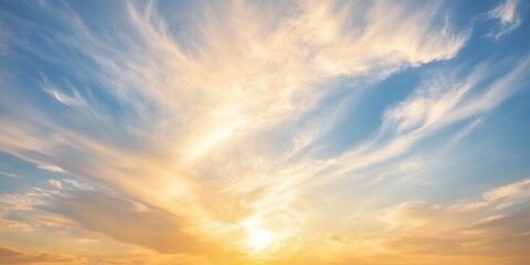 Obraz premium Dramatic Sunset Sky with Golden Hues and Wispy Clouds Peaceful Atmospheric Background