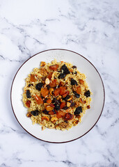 rice dish with dried fruits, nuts and spices of Middle Eastern cuisine, homemade, no people,