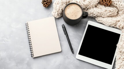 Fototapeta premium A notebook, pen, and tablet are on a table
