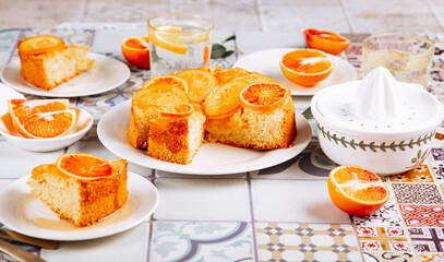 Orange cake with fruit citrus slices.