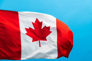 Canada flag waving on blue background