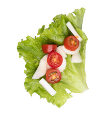 portion of small fresh salad of tomato palm and lettuce isolated top view