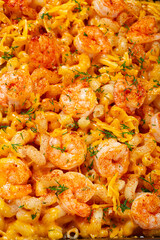 pasta with shrimp and cheese, with a golden crust, cooked in a baking dish, homemade, no people,