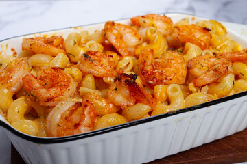 pasta with shrimp and cheese, with a golden crust, cooked in a baking dish, homemade, no people,