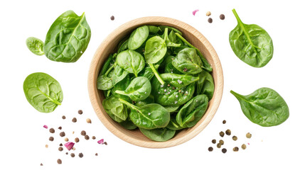 Obraz premium Fresh green spinach leaves in a wooden bowl with scattered leaves around, showcasing a healthy, vibrant composition on a white isolate background.