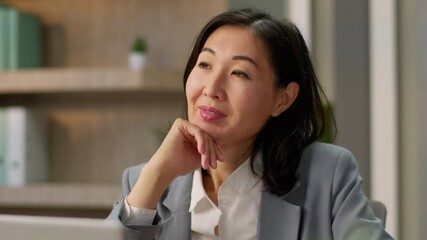 Dreaming Asian businesswoman thoughtful smiling girl Chinese Korean business woman Japanese female thinking alone in office inspired adult employer manager dream think wish ponder looking idea plan