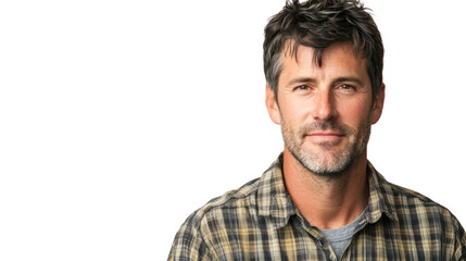 Obraz premium Confident man with a beard wearing a plaid shirt, smiling against a white isolated background.
