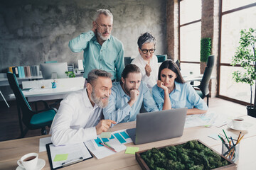 Photo of teamwork startup partners worried people look netbook problem stressed comfortable nice...