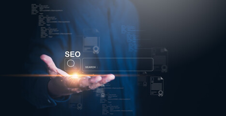 A businessman hand extends with glowing elements representing SEO search, symbolizing digital...