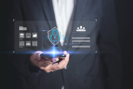 A professional individual holding a smartphone with digital security icons and data overlays, emphasizing technology and security.